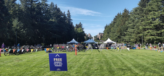 gameday bike valet parking begins to fill on the rainier vista lawn on a sunny day